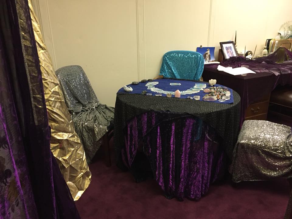 after example round table with colorful fabrics and sparkly chairs