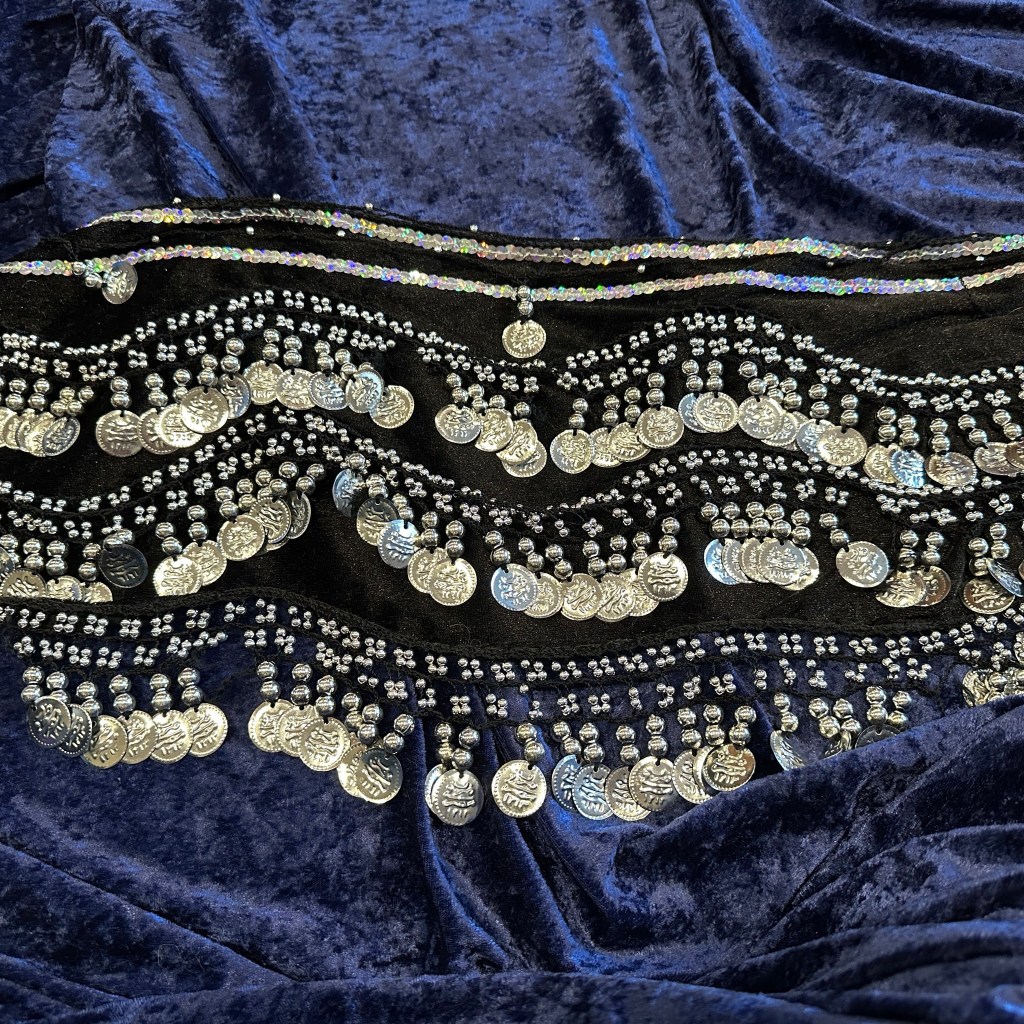 black hip scarf with silver bangles